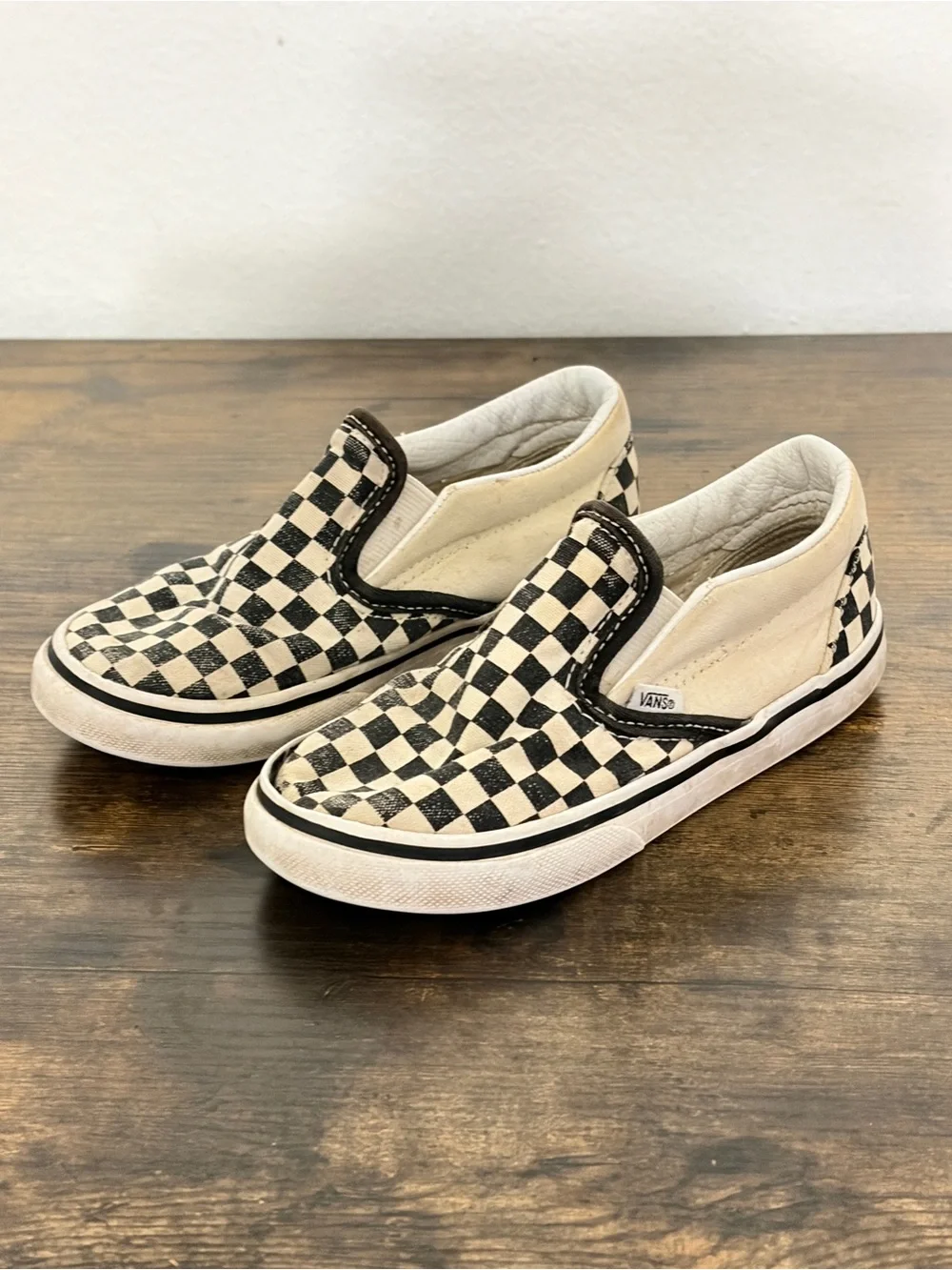 Vans Kids Slip-On Checkerboard Sneakers in Black and Cream